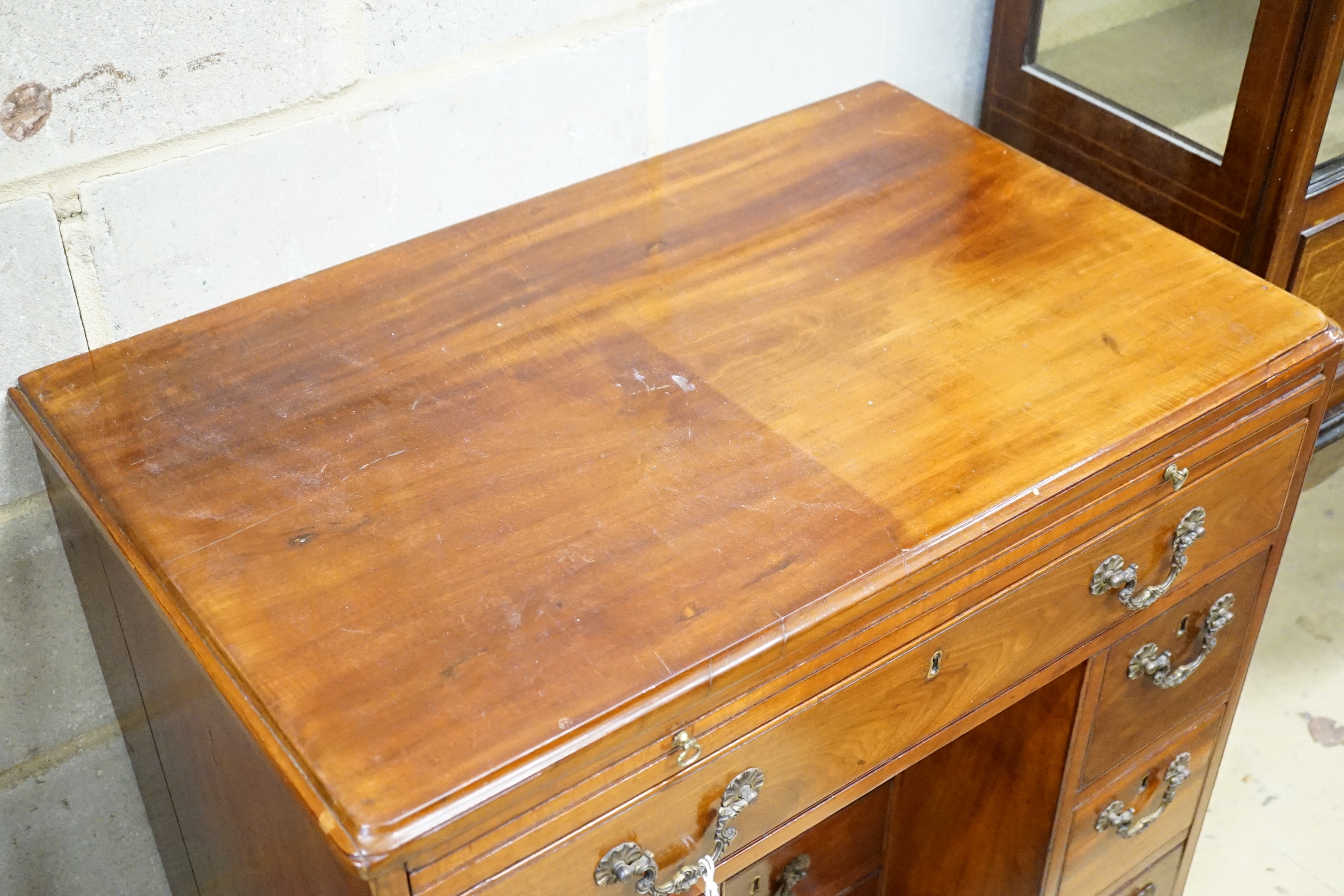 A George III mahogany kneehole desk with slide and four recess drawers, width 80cm, height 79cm